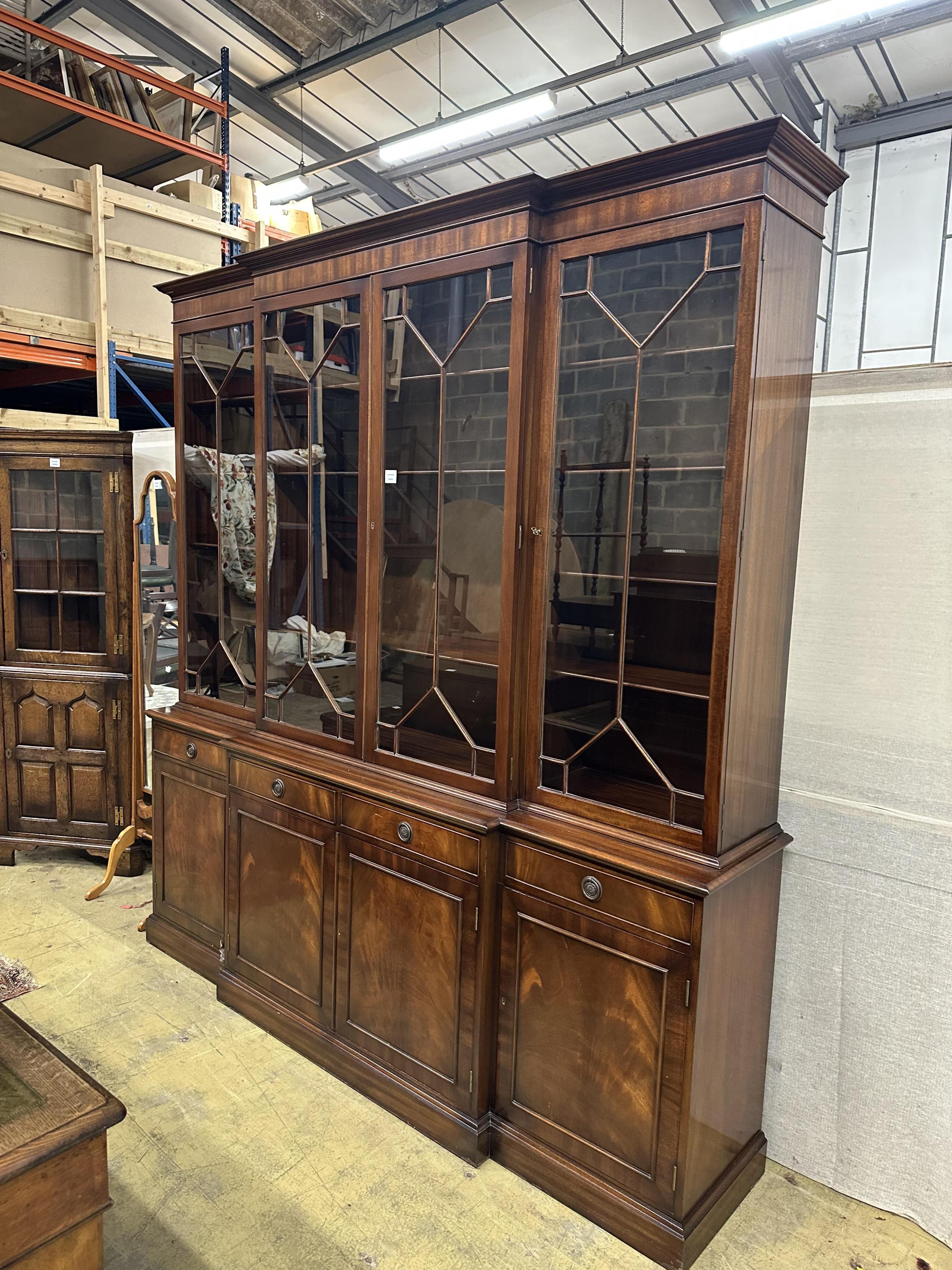 A reproduction George III style mahogany breakfront library bookcase, width 204cm, depth 48cm, height 220cm. Condition - good